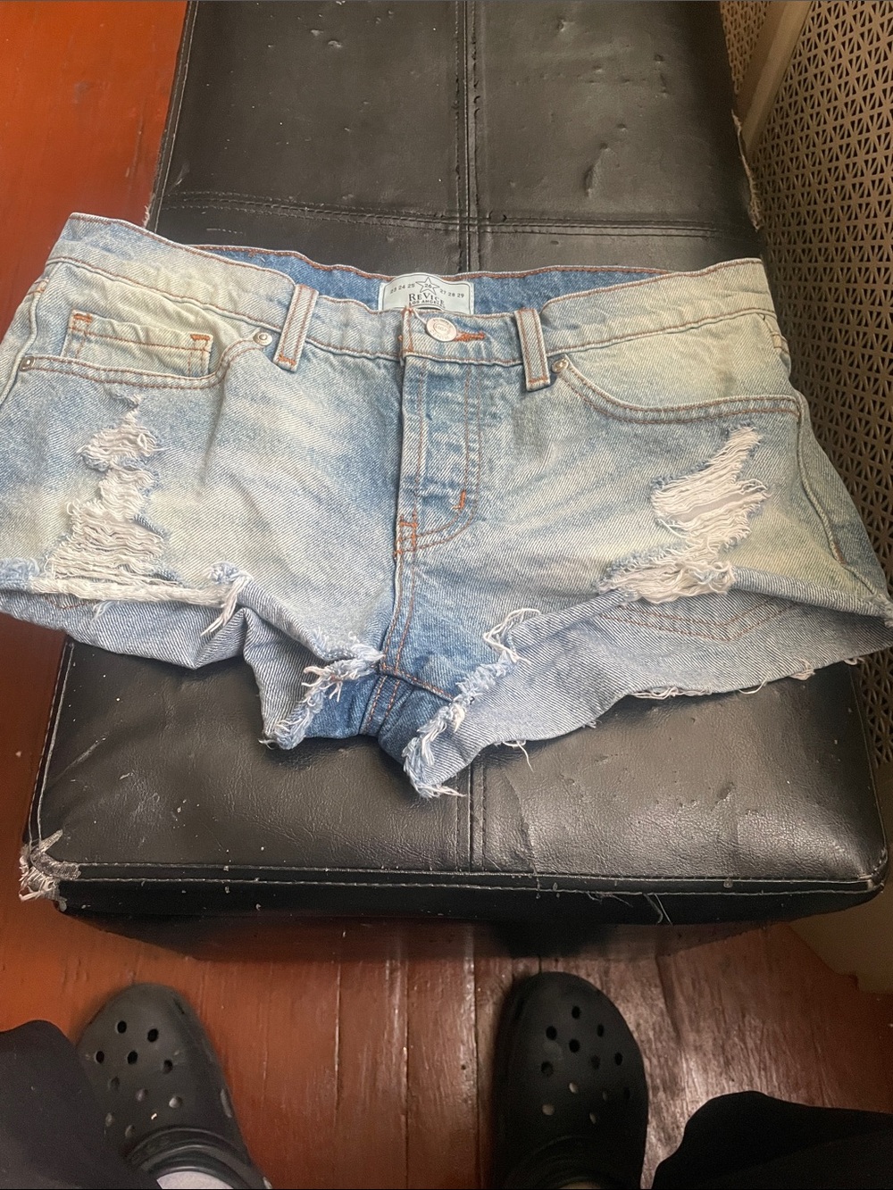 REVICE light wash distressed denim cut-off shorts